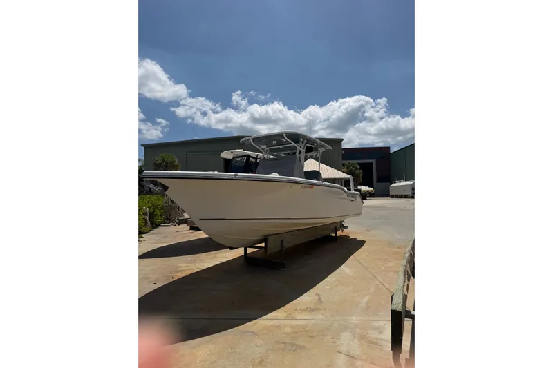 Slide: The Image of 2022 Key West 263 FS boat on display under a clear blue sky. - 3