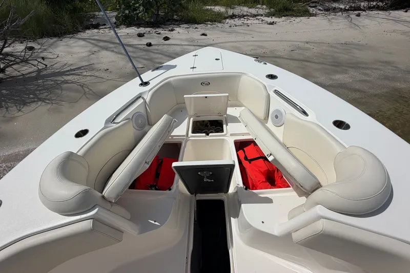 Slide: The Image of 2022 Key West 263 FS boat interior with seating and storage compartments. - 15
