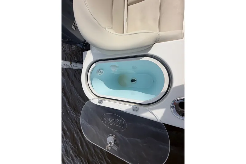 Slide: The Image of Livewell on 2022 Key West 263 FS boat, open with clear lid. - 6