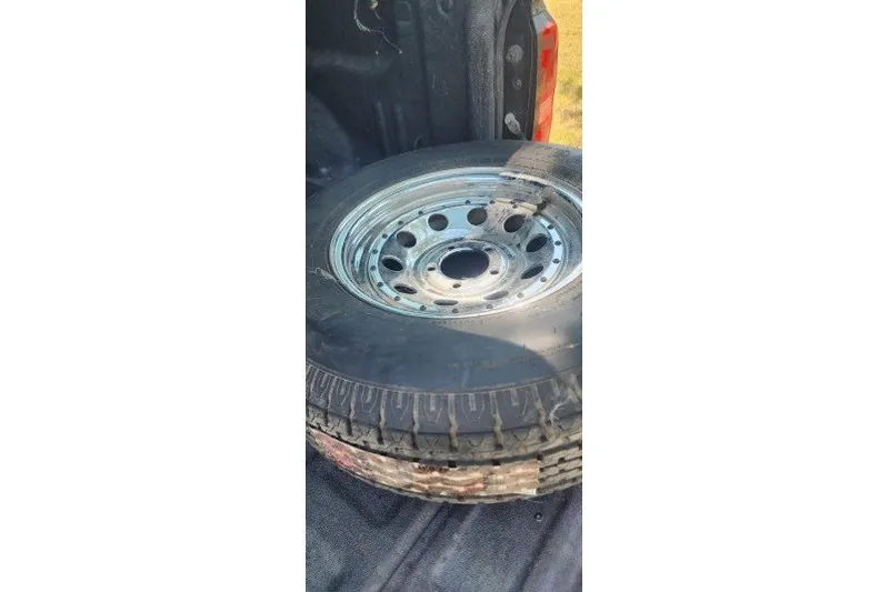 Slide: The Image of Spare tire in truck bed, Infinity ZX-1, 2001 model. - 21