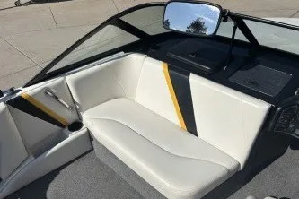Slide: The Image of 2001 Infinity ZX-1 boat interior with white and black seating, yellow accents, and a rearview mirror. - 11