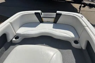 Slide: The Image of Interior of a 2001 Infinity ZX-1 boat with white seating and cup holders. - 14