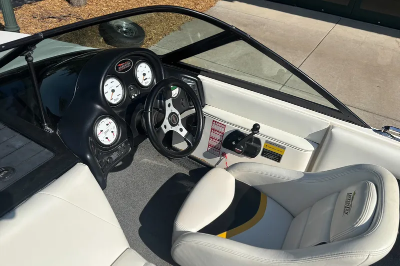 Slide: The Image of Interior of a 2001 Infinity ZX-1 boat with steering wheel and gauges. - 7