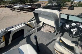 Slide: The Image of Interior of a 2001 Infinity ZX-1 boat with steering wheel and seating. - 10