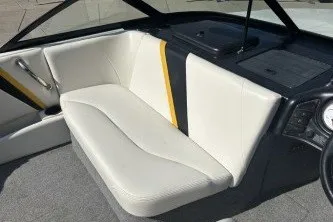 Slide: The Image of 2001 Infinity ZX-1 boat interior with white seating and yellow accent. - 9
