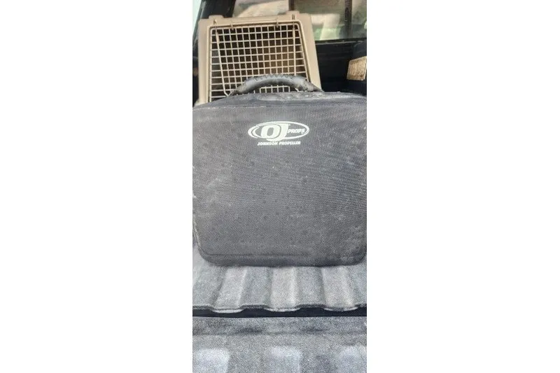 Slide: The Image of Black Johnson Propeller case in vehicle trunk, Infinity ZX-1, 2001 model. - 20