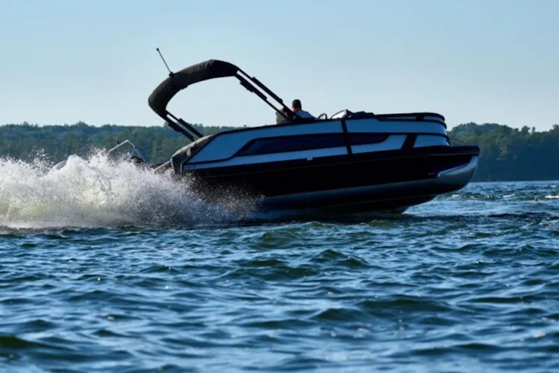 The Image of Evotti 723QL boat cruising on a lake, 2027 model, creating splashes. - 2