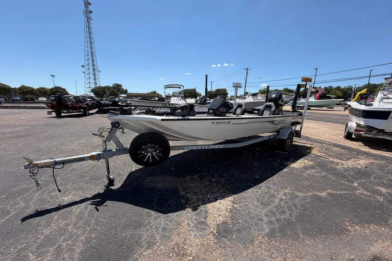 Slide: The Image of 2022 Crestliner XF 189 boat on trailer in outdoor dealership lot. - 2