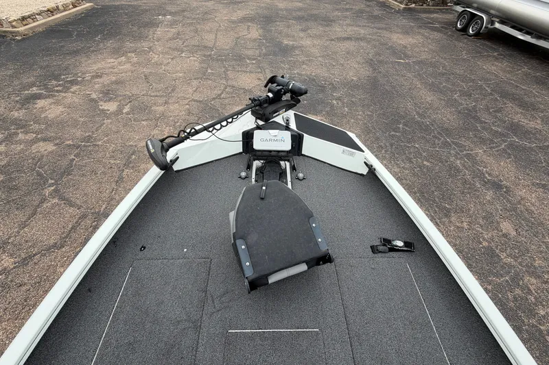 Slide: The Image of 2022 Crestliner XF 189 boat deck with Garmin equipment, parked on asphalt. - 11