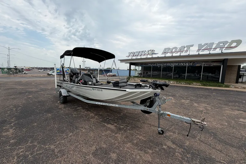 Slide: The Image of 2022 Crestliner XF 189 boat on trailer outside Yowell's Boat Yard showroom. - 4