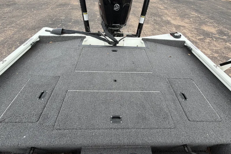 Slide: The Image of 2022 Crestliner XF 189 boat deck with storage compartments and motor. - 30
