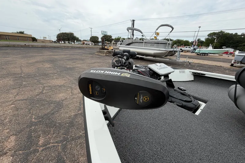 Slide: The Image of 2022 Crestliner XF 189 boat with Minn Kota Terrova trolling motor in a parking lot. - 13