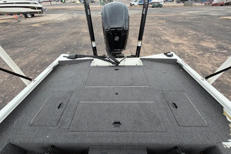 Slide: The Image of 2022 Crestliner XF 189 boat deck with motor, showcasing spacious fishing platform. - 27
