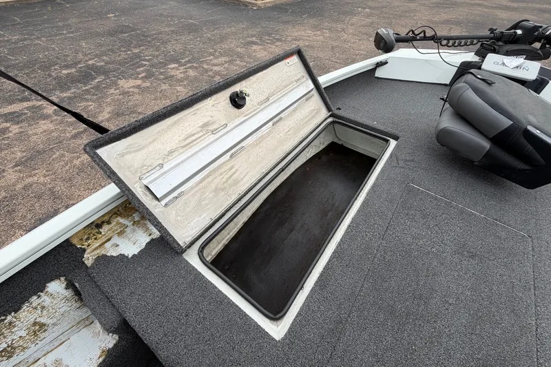 Slide: The Image of 2022 Crestliner XF 189 boat with open storage compartment and Garmin equipment. - 15