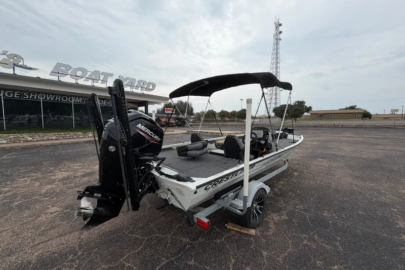 Slide: The Image of 2022 Crestliner XF 189 boat with Mercury engine at a dealership lot. - 9