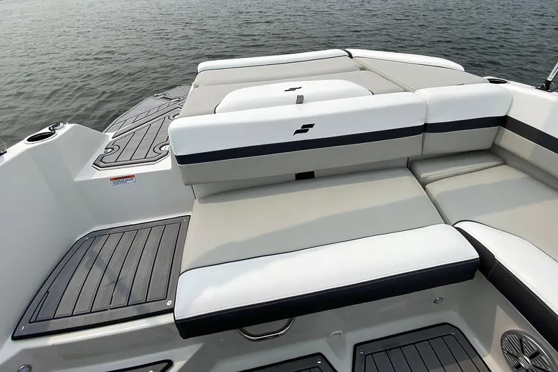 Slide: The Image of Manufacturer Provided Image: Starcraft SVX 230 DC OB 2026 boat rear on water. - 8