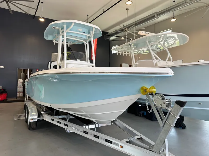 The Image of A 2024 Tidewater 210 CC Adventure boat in a showroom on a trailer. - 0