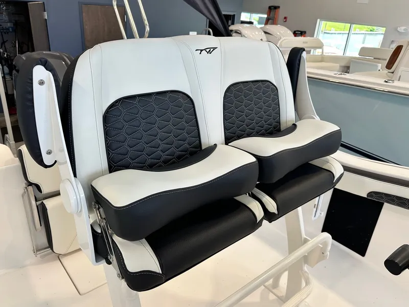 Slide: The Image of The 2024 Tidewater 210 CC Adventure seats are cushioned, offering comfort and style. - 13
