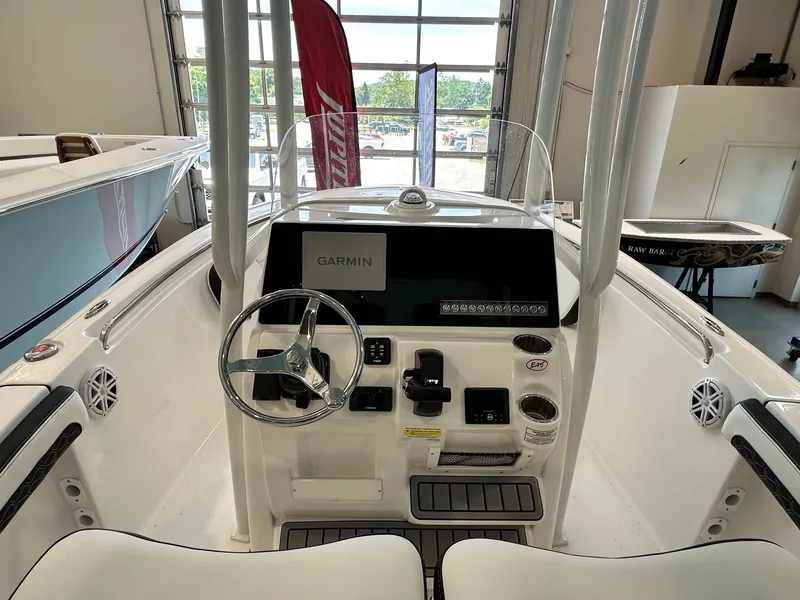 Slide: The Image of The image shows the cockpit of a 2024 Tidewater 210 CC Adventure boat with a Garmin display. - 7