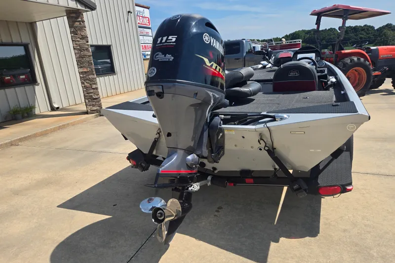 Slide: The Image of 2018 Ranger RT188 boat with Yamaha 115 engine, parked outside a building. - 24