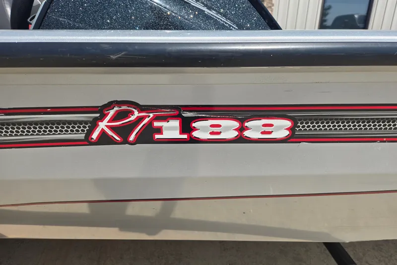 Slide: The Image of 2018 Ranger RT188 boat logo with red and white design on the side panel. - 23