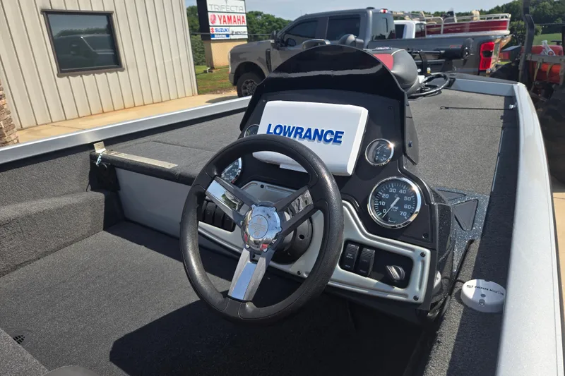 Slide: The Image of 2018 Ranger RT188 boat dashboard with steering wheel and Lowrance display. - 21