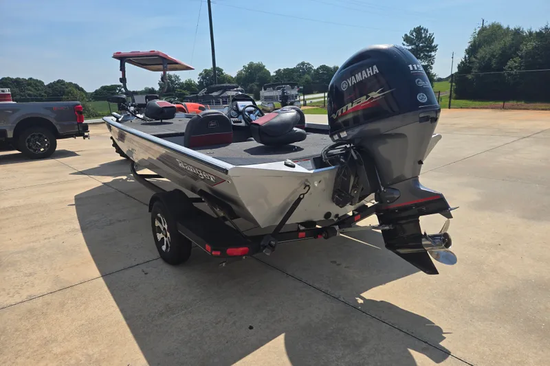 Slide: The Image of 2018 Ranger RT188 boat with Yamaha engine on a trailer in a parking lot. - 26