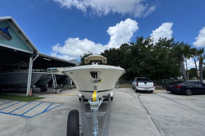Slide: The Image of 2027 Chris-Craft Catalina 28 boat on trailer under blue sky. - 6