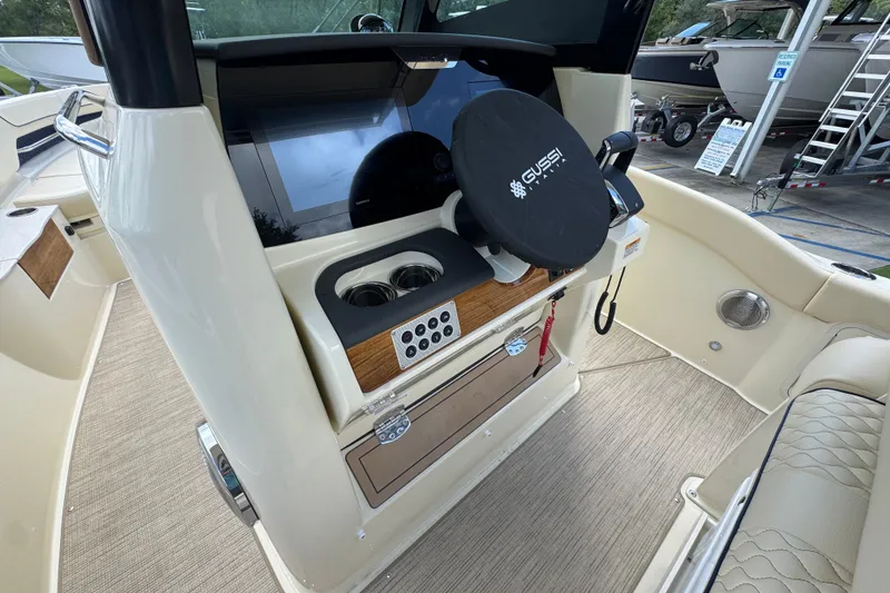 Slide: The Image of Helm of 2027 Chris-Craft Catalina 28 with modern controls and steering wheel cover. - 34