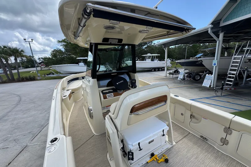 Slide: The Image of 2027 Chris-Craft Catalina 28 boat interior with helm and seating area. - 38