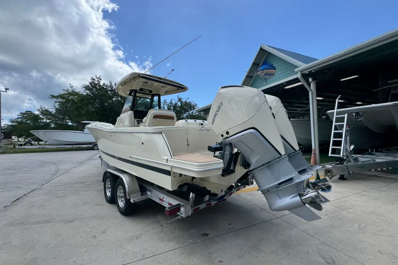 Slide: The Image of 2027 Chris-Craft Catalina 28 boat on trailer, parked outdoors near a building. - 18