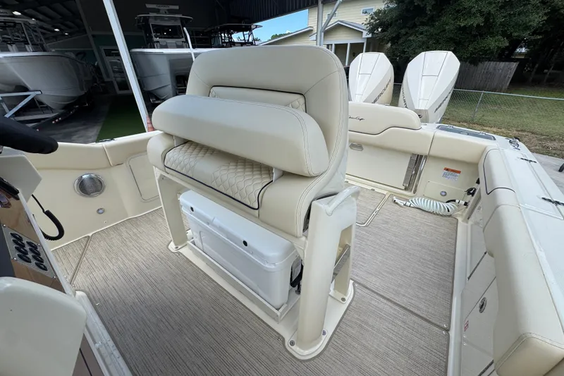 Slide: The Image of 2027 Chris-Craft Catalina 28 boat interior with beige seating and modern design. - 30