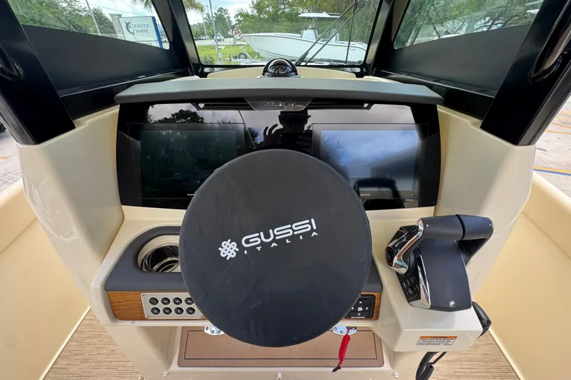 Slide: The Image of 2027 Chris-Craft Catalina 28 helm with Gussi Italia steering wheel and modern controls. - 35