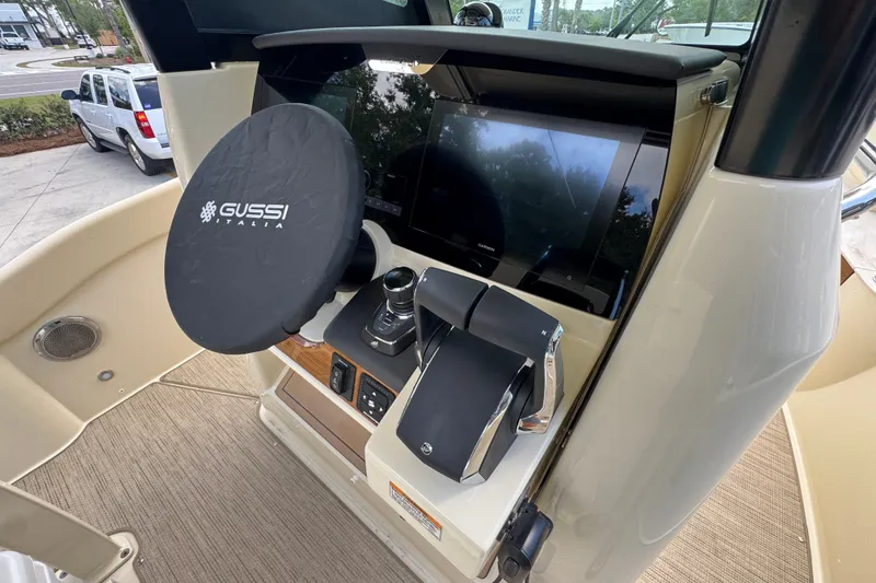 Slide: The Image of 2027 Chris-Craft Catalina 28 helm with Gussi Italia steering wheel and Garmin display. - 37