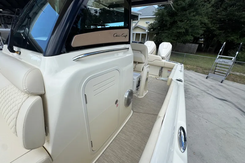 Slide: The Image of 2027 Chris-Craft Catalina 28 boat interior with beige seating and modern design. - 27