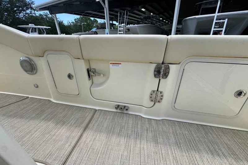 Slide: The Image of 2027 Chris-Craft Catalina 28 boat interior with storage compartments and speaker. - 40