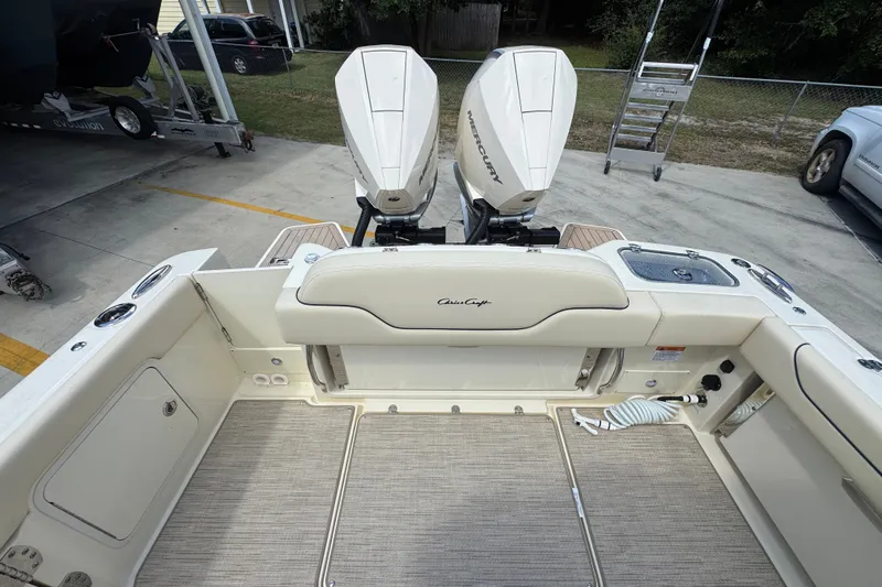 Slide: The Image of 2027 Chris-Craft Catalina 28 boat interior with twin Mercury engines, docked outdoors. - 42