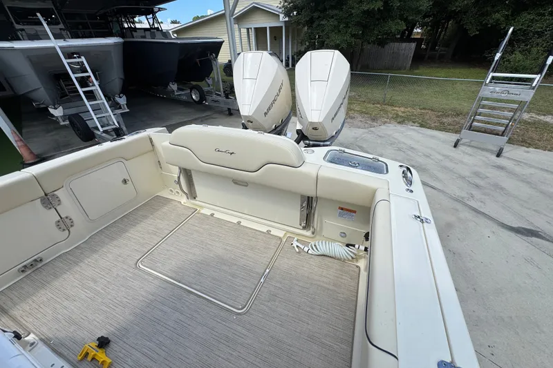 Slide: The Image of 2027 Chris-Craft Catalina 28 boat interior with twin Mercury engines, docked outdoors. - 41