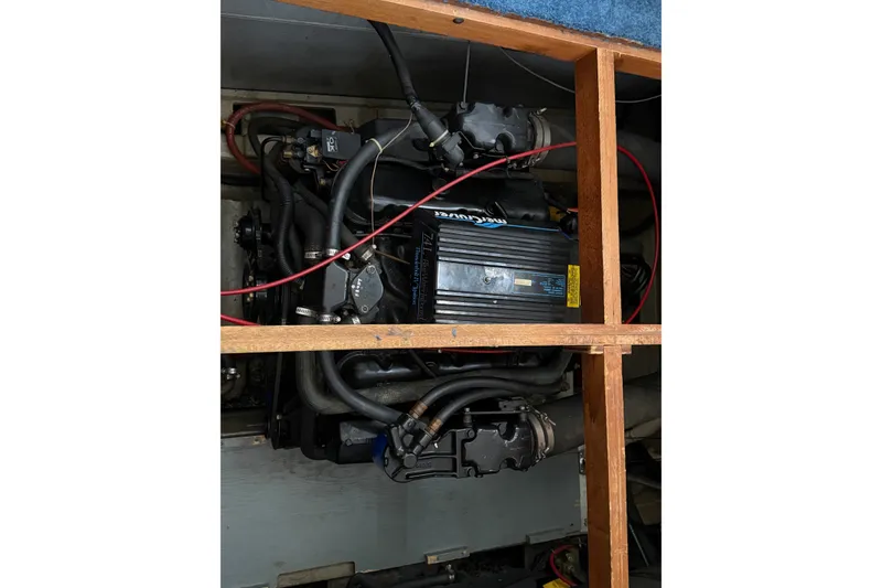 Slide: The Image of Engine compartment of a 1989 Carver 3607 Aft Cabin Motor Yacht, showcasing mechanical components. - 51
