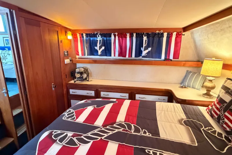 Slide: The Image of Cozy cabin interior of 1989 Carver 3607 Aft Cabin Motor Yacht with nautical decor. - 38