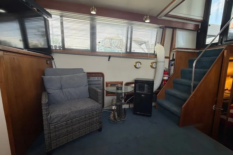 Slide: The Image of Interior of 1989 Carver 3607 Aft Cabin Motor Yacht with seating and stairs. - 22