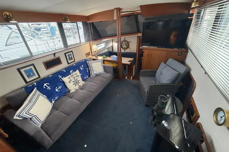 Slide: The Image of Interior of 1989 Carver 3607 Aft Cabin Motor Yacht with cozy seating and nautical decor. - 20