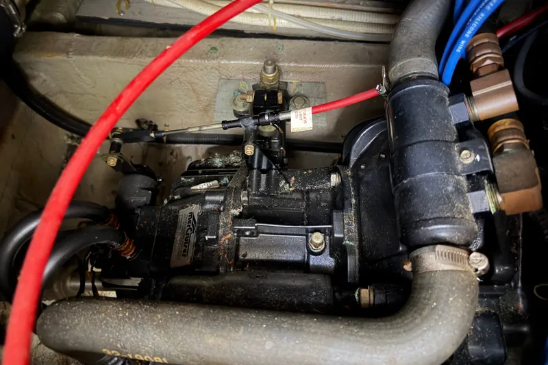 Slide: The Image of Engine compartment of a 1989 Carver 3607 Aft Cabin Motor Yacht, showing mechanical components. - 49