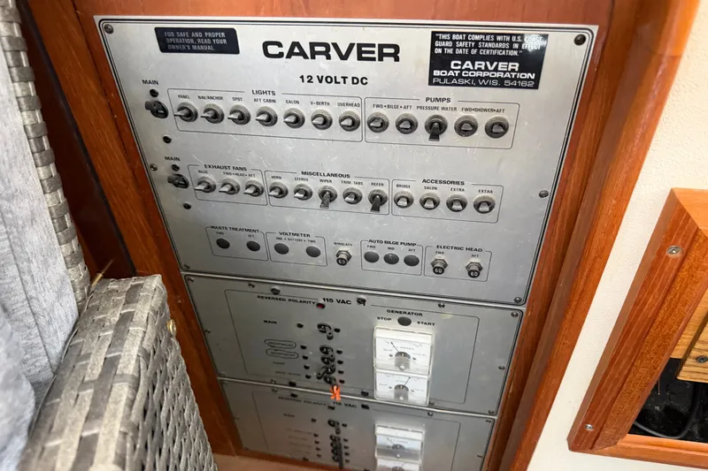 Slide: The Image of Electrical panel of 1989 Carver 3607 Aft Cabin Motor Yacht, featuring various switches and controls. - 43