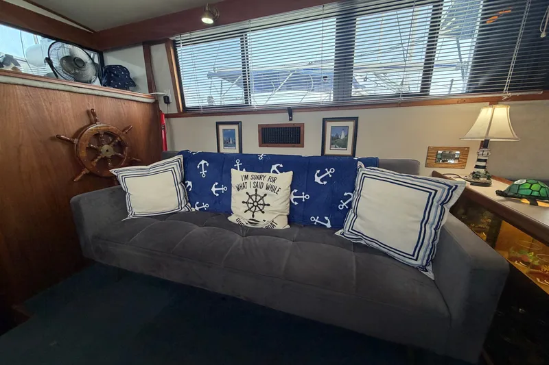 Slide: The Image of Cozy interior of 1989 Carver 3607 yacht with nautical-themed decor and cushions. - 21