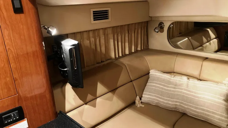 Slide: The Image of 2008 Regal 3760 yacht interior with beige leather seating and mounted TV. - 43