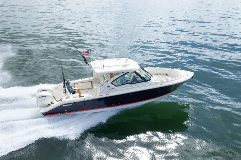 Slide: The Image of 2026 Pursuit DC 326 Dual Console boat cruising on open water. - 1