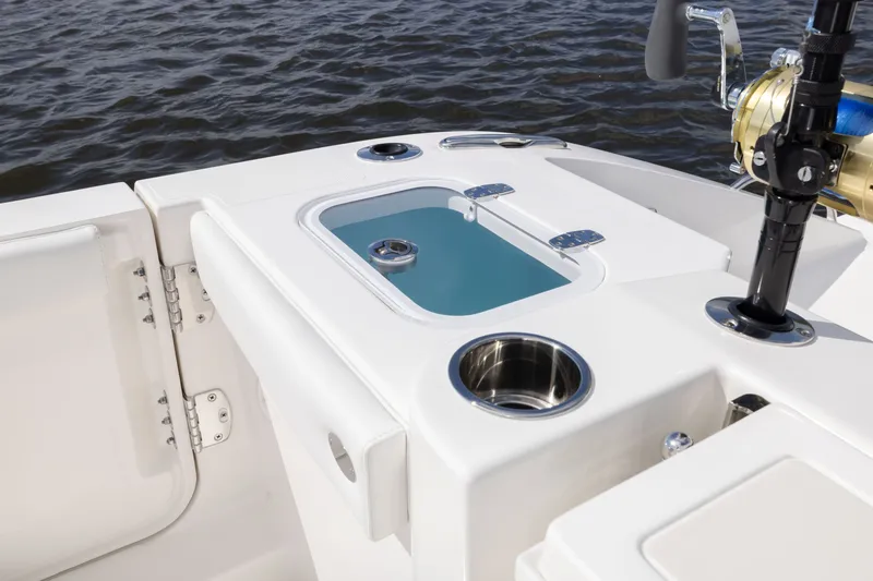 Slide: The Image of 2026 Pursuit DC 326 Dual Console boat with fishing rod holder and livewell on deck. - 22