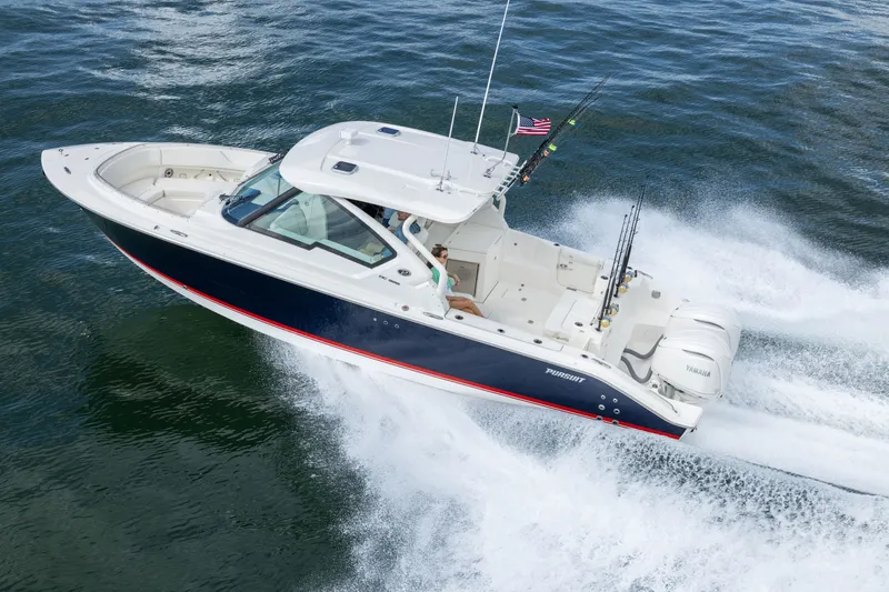 Slide: The Image of 2026 Pursuit DC 326 Dual Console boat cruising on open water. - 7