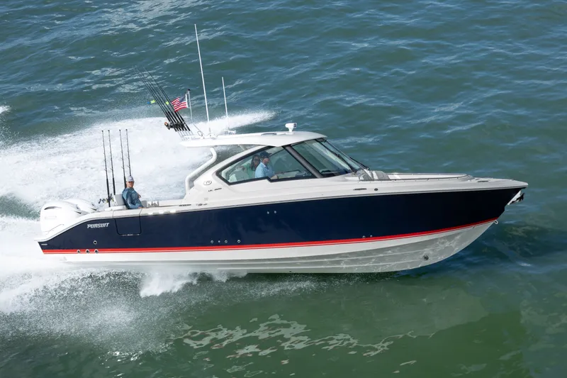 The Image of 2026 Pursuit DC 326 Dual Console boat cruising on open water. - 2